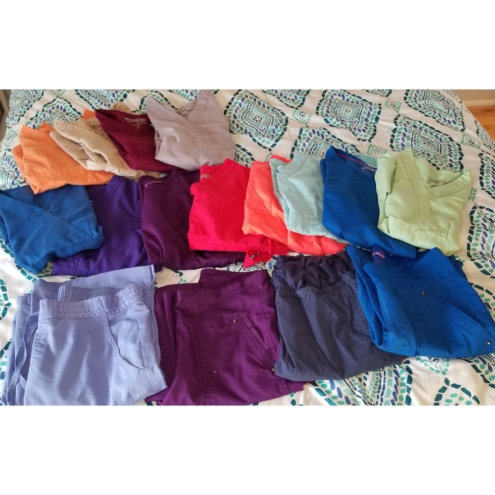 Various Greys Anatomy scrub tops and bottoms
